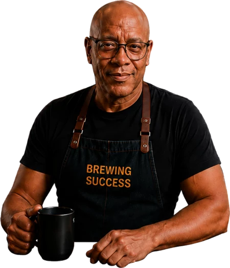 Lewis Cash holding a steaming coffee mug